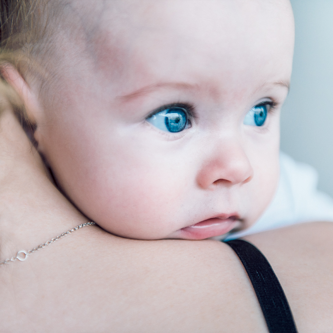 Baby on mothers shoulder