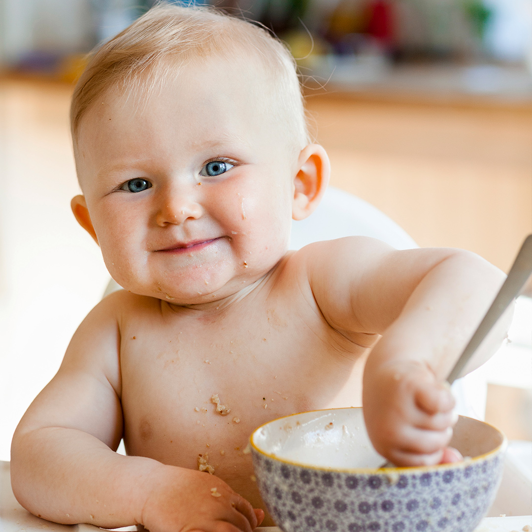Baby eating porridge
